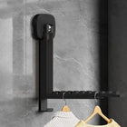 Tendedero de ropa plegable ahorrando espacio en pared