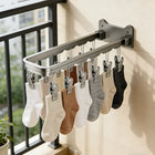 Colgador plegable de acero inoxidable para ropa pequeña
