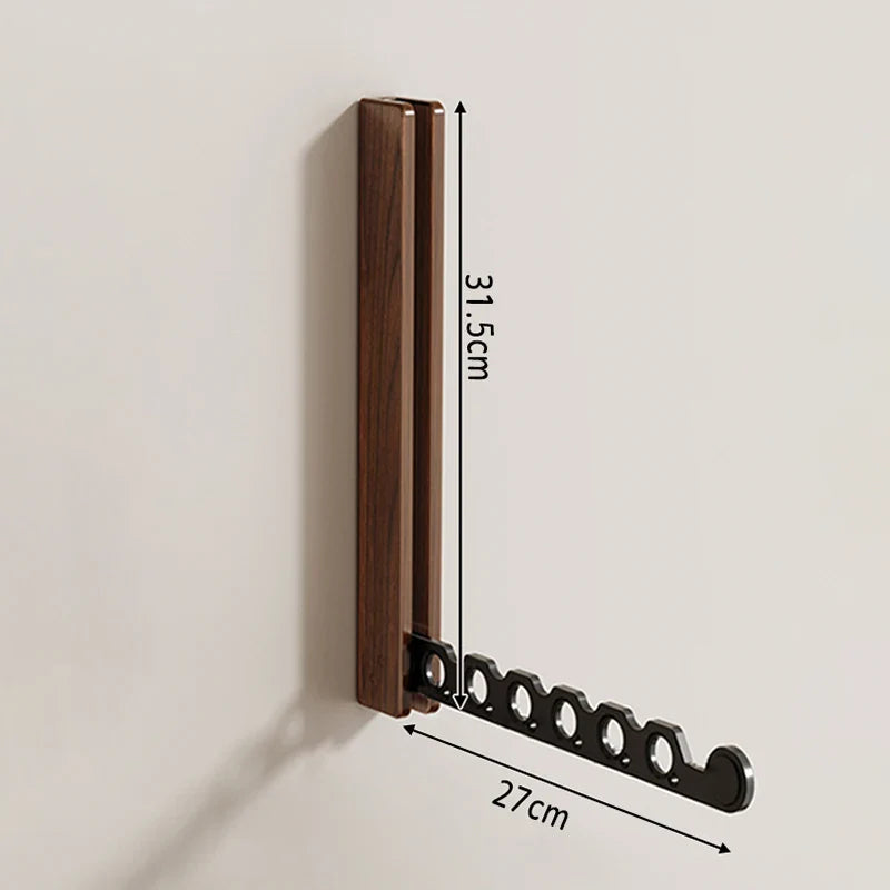Tendedero de pared plegable con ropa