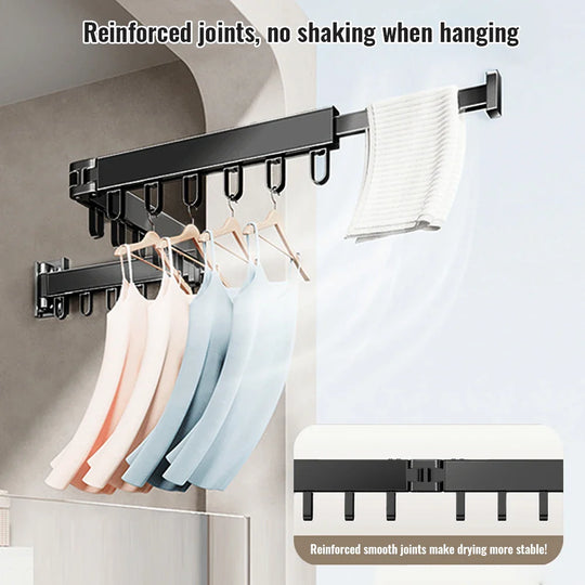Tendedero plegable con ropa colgada