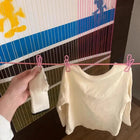 Cuerda de ropa con carcasa compacta