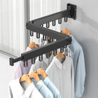 Tendedero de ropa de aluminio plegado contra la pared